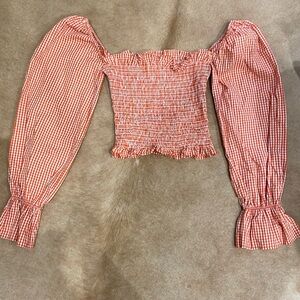 Le semiane Paris smocked red gingham blouse.